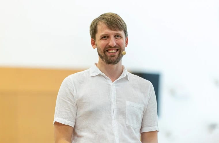 Rytis speaking at an event